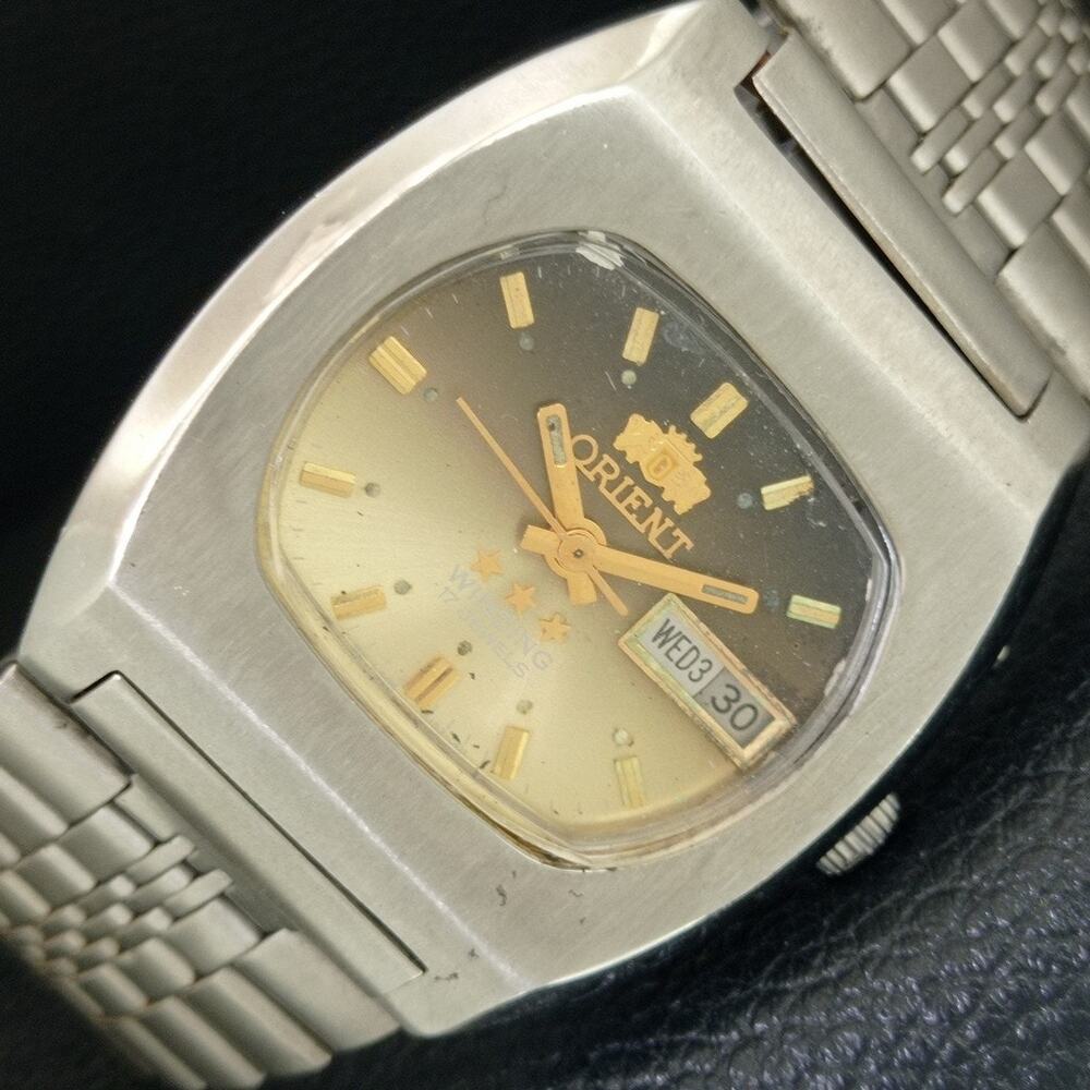 Vintage 1973 Orient Manual Mens Silver Watch W/daydate & Gold accents